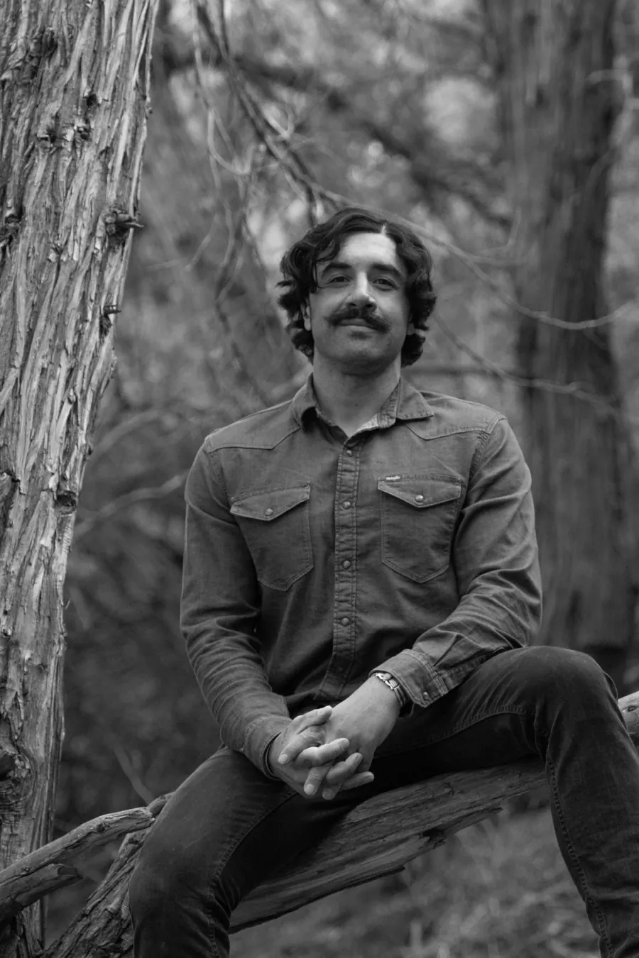 Seated black-and-white author portrait